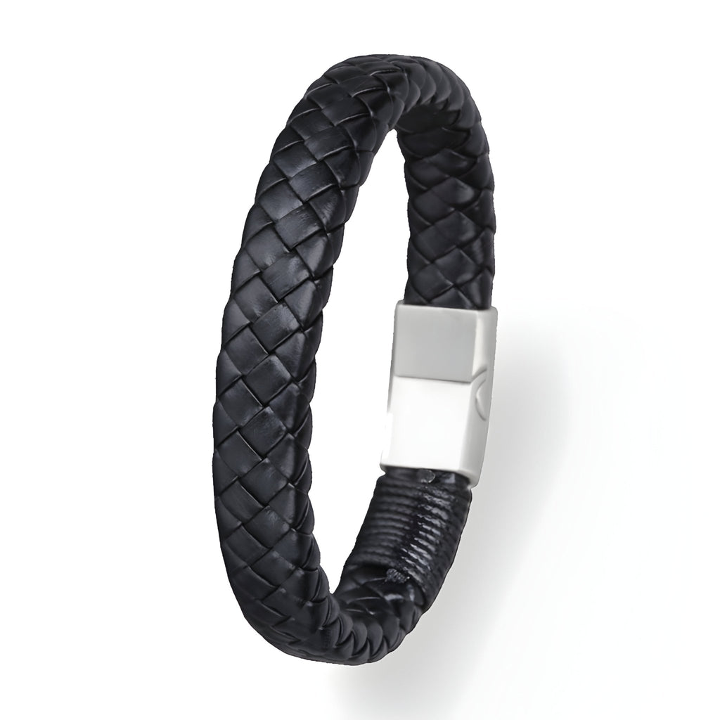 Bracelet épais en cuir noir tressé avec fermoir magnétique en acier argenté.