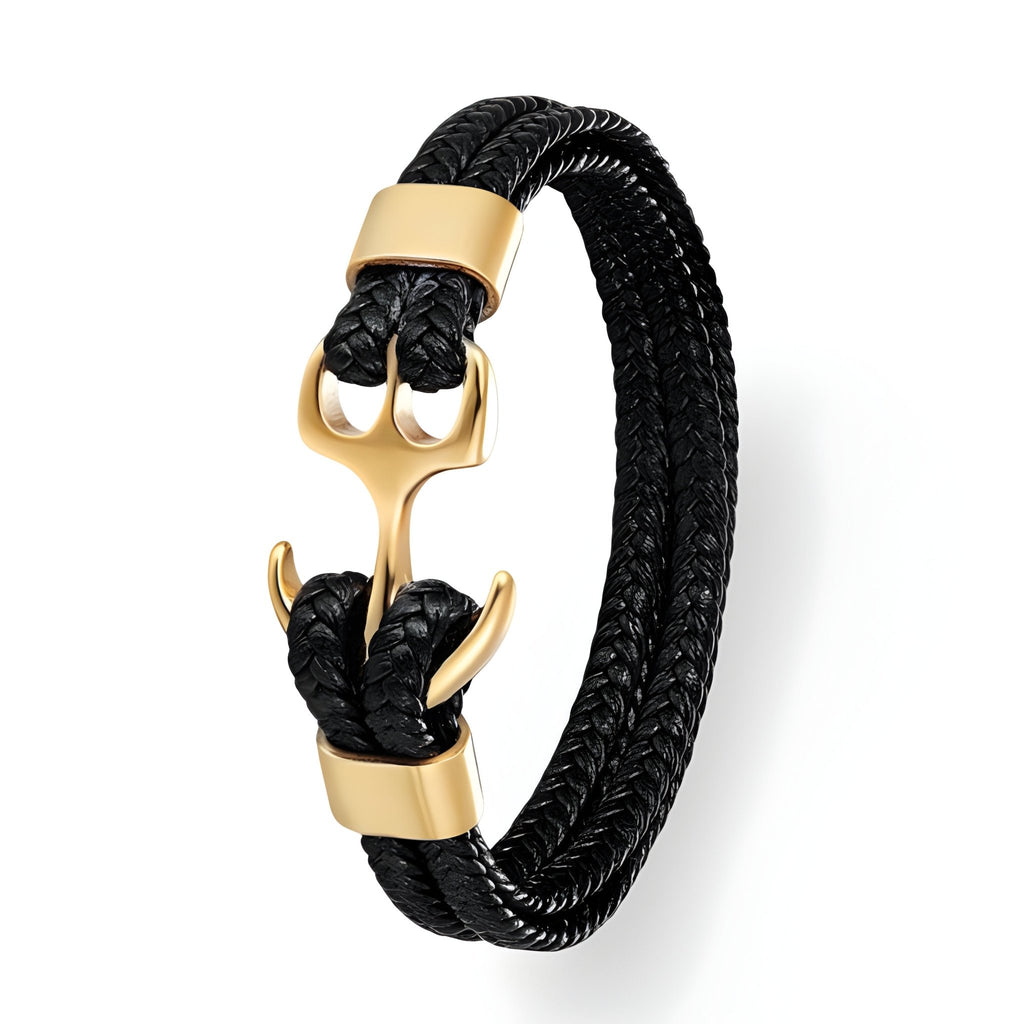 Bracelet en cuir noir tressé avec motif ancre dorée et fermoir élégant.