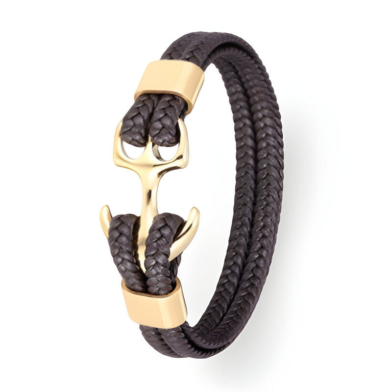 Bracelet en cuir noir tressé avec motif ancre dorée et fermoir assorti.