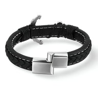 Bracelet en cuir noir tressé avec motif ancre en acier inoxydable et fermoir carré poli.
