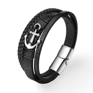 Bracelet en cuir noir tressé avec motif ancre marine argentée et fermoir magnétique en acier inoxydable.