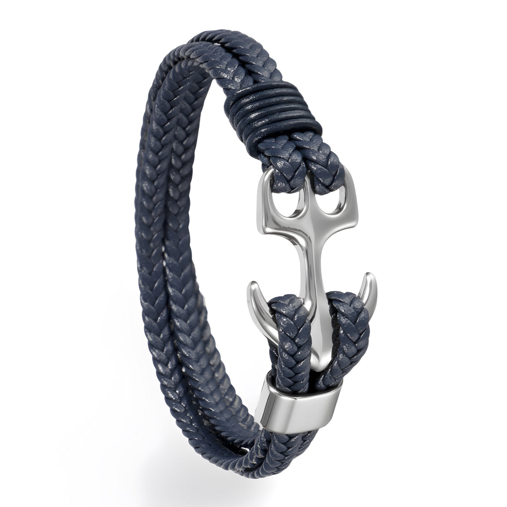 Bracelet tressé bleu marine avec ancre en métal argenté, style marin élégant.