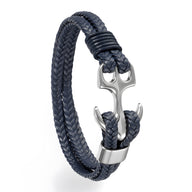Bracelet tressé bleu marine avec ancre en métal argenté, style marin élégant.