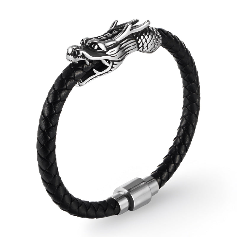 Bracelet en cuir noir tressé avec tête de dragon en métal argenté et fermeture magnétique acier.