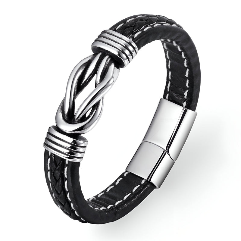 Bracelet en cuir noir tressé avec nœud argenté et fermoir magnétique en acier inoxydable.