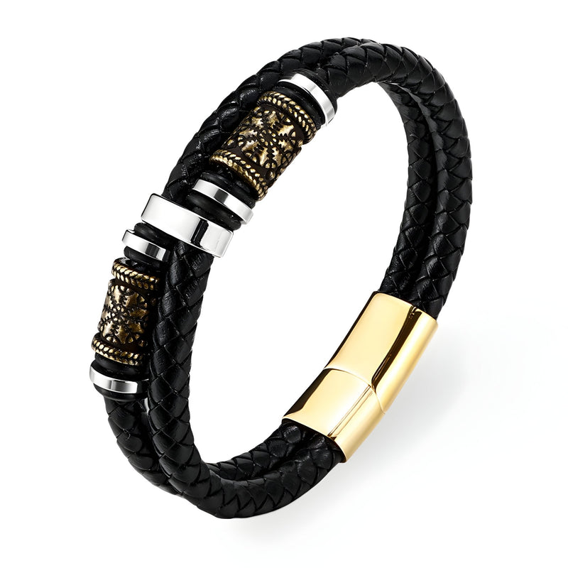 Bracelet en cuir noir tressé avec motif viking doré et fermoir magnétique doré.