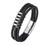 Bracelet en cuir noir tressé à double tour avec motifs métalliques argentés et fermoir magnétique barrette.