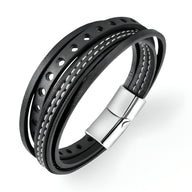 Bracelet multi-rangs en cuir noir ajouré avec coutures blanches et fermoir argenté magnétique.