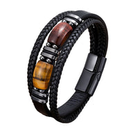 Bracelet multi-rangs homme cuir noir tressé avec pierres oeil de tigre marron et fermoir aimanté noir mat.