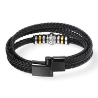 Bracelet homme en cuir noir tressé à double tour avec motif métallique argenté et doré, fermoir noir mat.