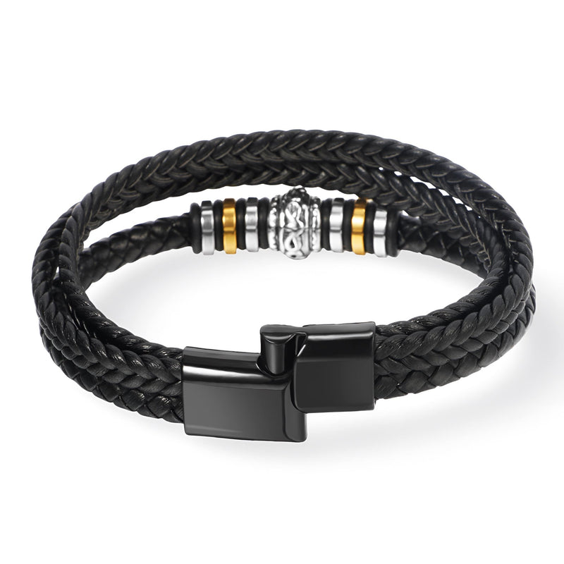 Bracelet homme en cuir noir tressé à double tour avec motif métallique argenté et doré, fermoir noir mat.