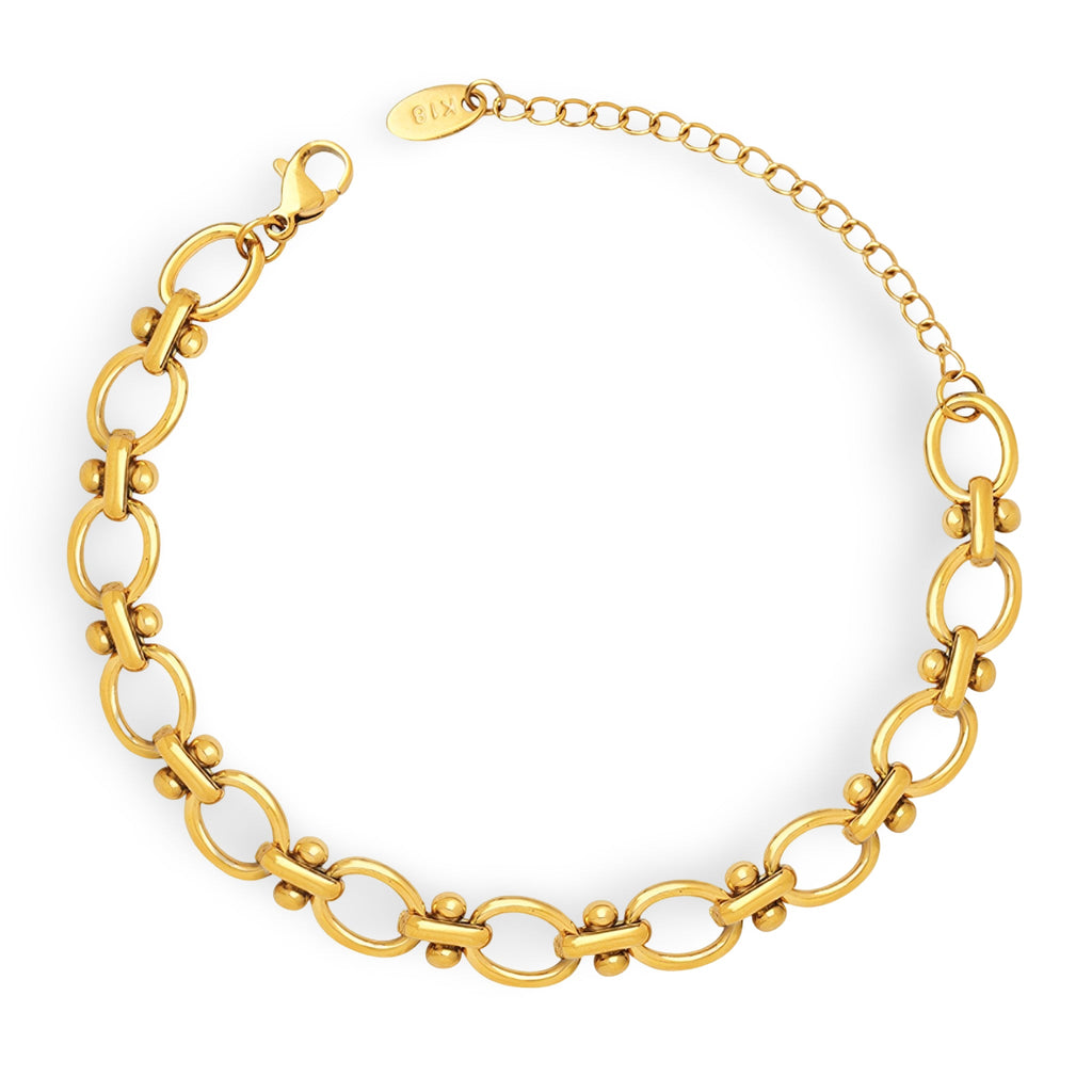 Bracelet chaîne marine en titane plaqué or avec fermoir mousqueton et extension réglable.