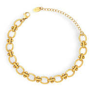 Bracelet chaîne marine en titane plaqué or avec fermoir mousqueton et extension réglable.