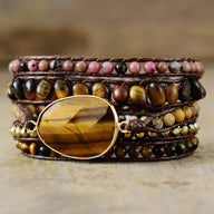 Bracelet multi-rangs femme en pierres naturelles œil de tigre marron et rhodonite rose avec breloque ovale dorée.