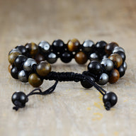 Bracelet homme perles oeil de tigre, hématite noire et shaligram avec fermoir coulissant noir.