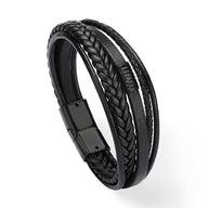 Bracelet multi-rangs noir en cuir, mêlant bandes tressées et lisses avec fermoir magnétique noir mat.