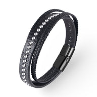 Bracelet multi-rangs noir en cuir avec rivets métalliques et fermoir magnétique noir mat.