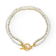 Bracelet double rang en titane plaqué or 18 carats avec perles blanches et pierres de zircon serties.