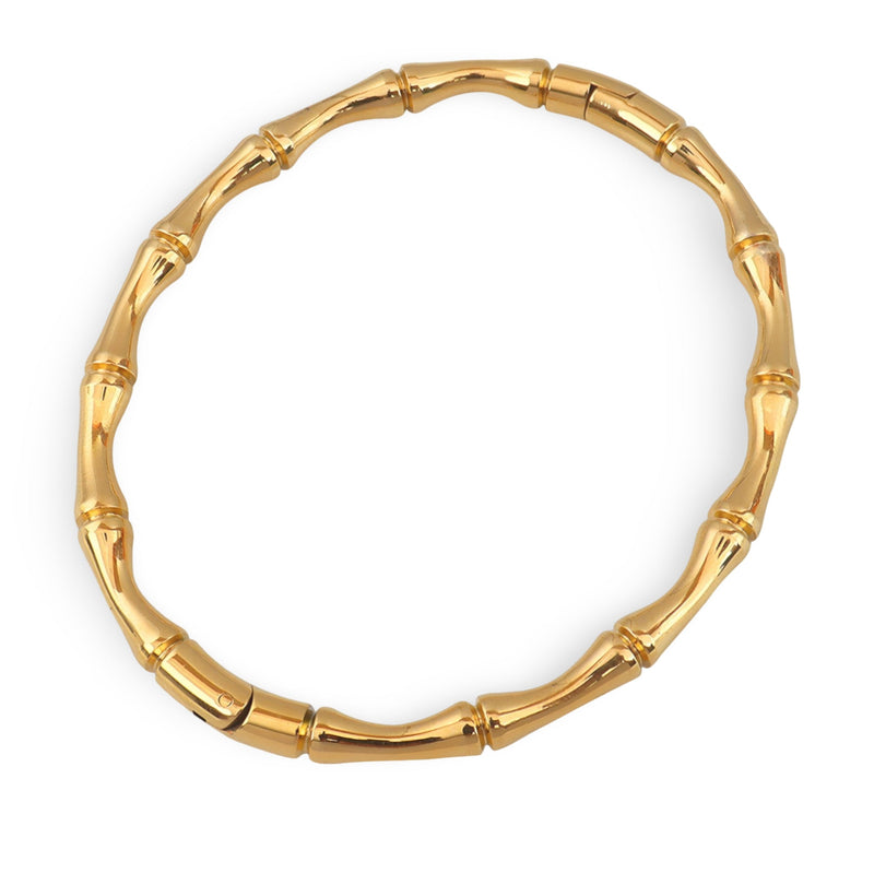 Bracelet rigide en titane plaqué or 18 carats avec motif bambou lisse et brillant.