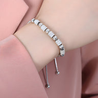 Bracelet en titane argenté orné de perles dorées et pierres de cristal scintillantes, modèle Nancy.