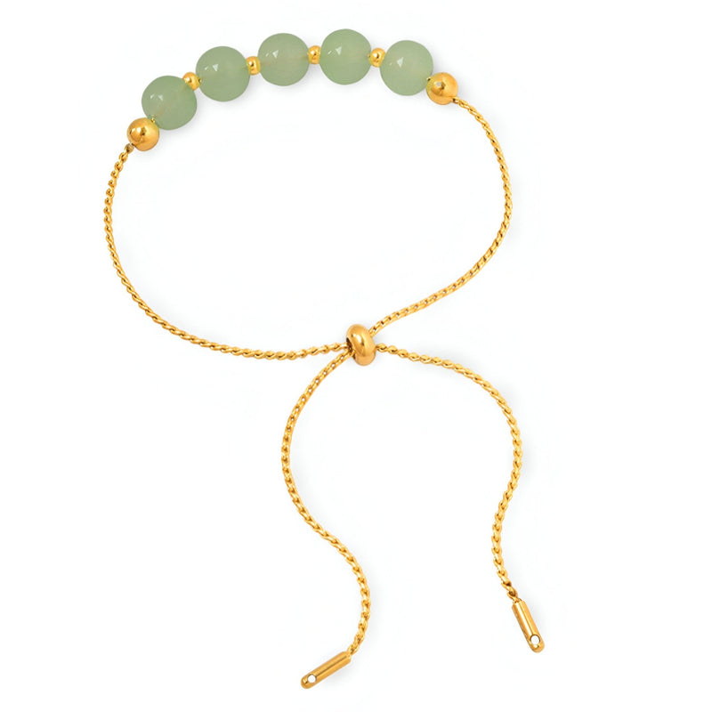 Bracelet réglable en titane plaqué or avec sept pierres épaisses de jade vert clair.