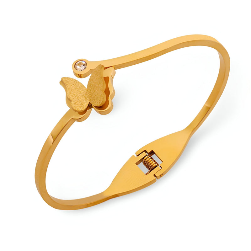Bracelet rigide en titane plaqué or avec papillon et zircon incrusté, fermoir à charnière.