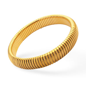 Bracelet jonc flexible en titane plaqué or avec finition nervurée brillante.