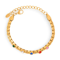 Bracelet en titane plaqué or avec maillons larges et pierres de zircons colorées incrustées, modèle Daisy.