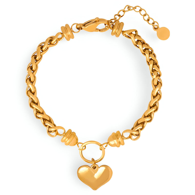 Bracelet en titane plaqué or avec maille torsadée et pendentif cœur lisse brillant.