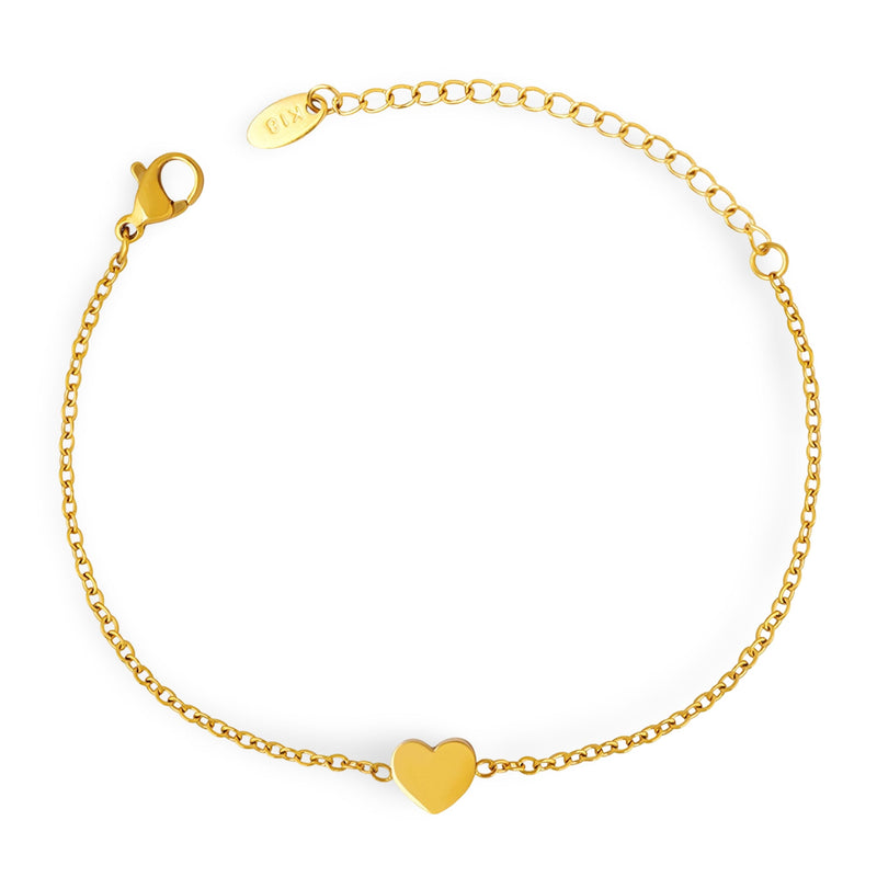 Bracelet fin en titane plaqué or 18 carats avec motif cœur central et chaîne délicate.