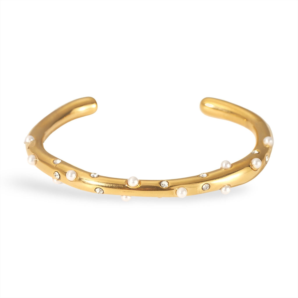 Bracelet jonc or avec perles blanches délicates réparties uniformément.