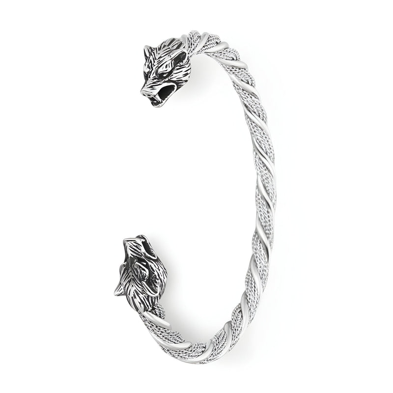 Bracelet jonc en acier inoxydable argenté torsadé avec têtes de loup détaillées aux extrémités.