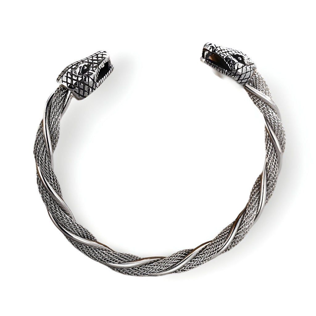 Bracelet jonc argent en acier inoxydable torsadé avec doubles têtes de serpent détaillées.