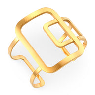 Bracelet manchette en métal doré à design géométrique contemporain avec formes rectangulaires ajourées.
